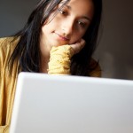 Young woman using laptop in a Cafe-905214