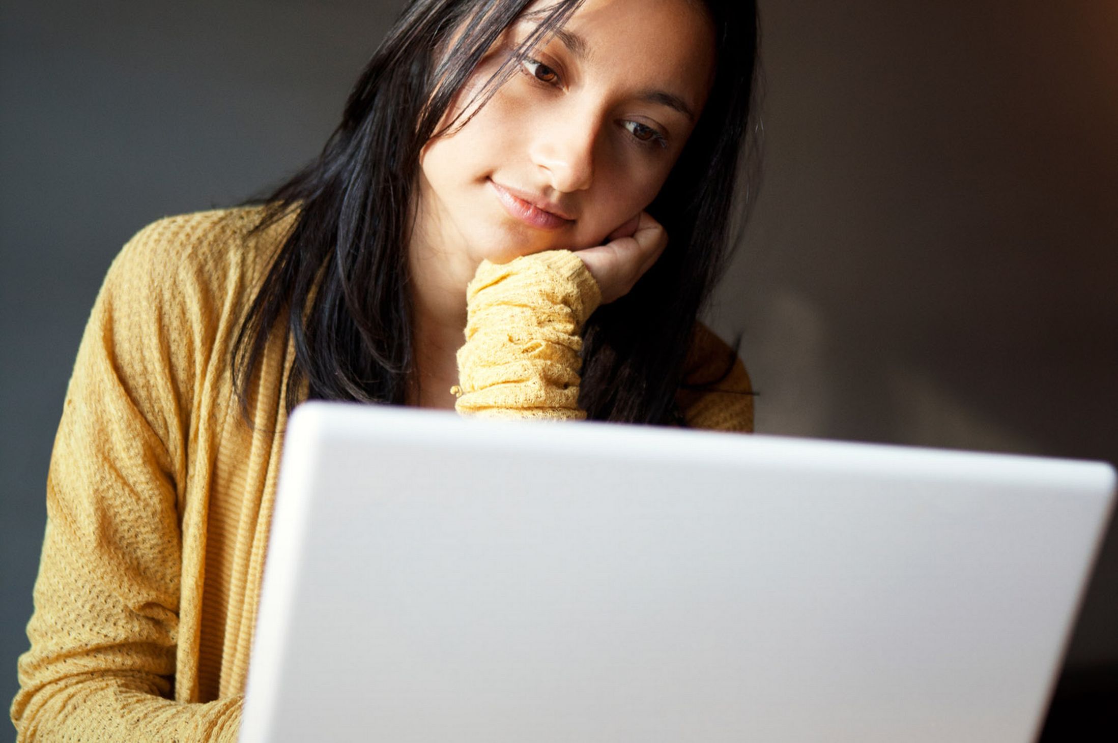 Young woman using laptop in a Cafe-905214